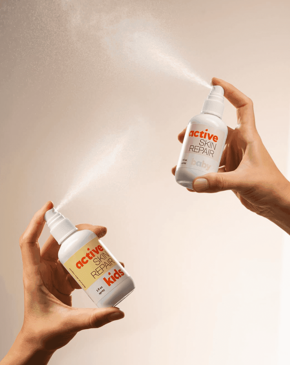 Two Active Skin Repair spray bottles labeled Kids and Baby.